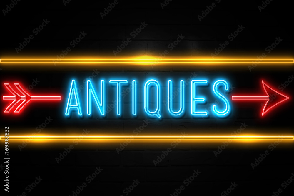 Antiques - fluorescent Neon Sign on brickwall Front view Antiques - fluorescent Neon Sign on brickwall Front view
