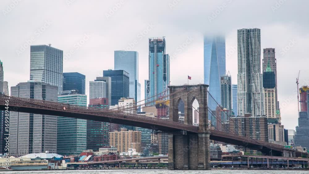 A dramatic summer time lapse view of Lower Manhattan and the Brooklyn Bridge A dramatic summer time lapse view of Lower Manhattan and the Brooklyn Bridge