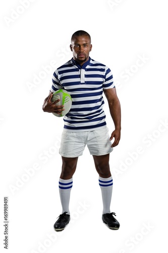 Portrait of sportsman wearing sports uniform holding rugby ball