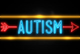 Autism  - fluorescent Neon Sign on brickwall Front view