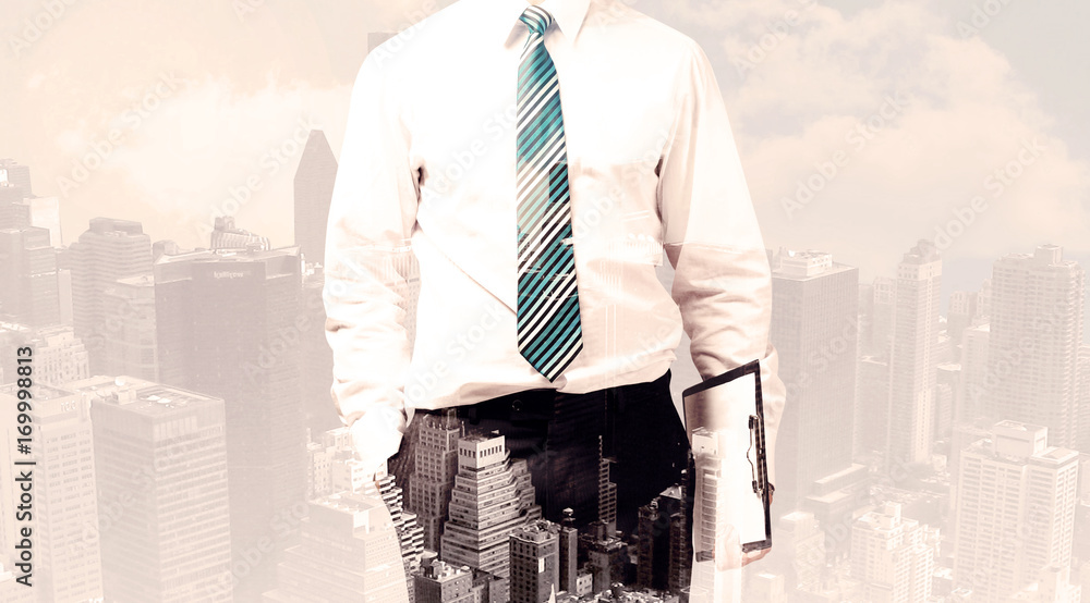 Handsome business man with overlay cityscape