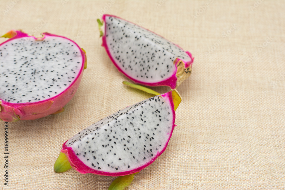 Healthy dragon fruits on wooden background,Dragon fruit on wooden background close up with copy space Healthy dragon fruits on wooden background,Dragon fruit on wooden background close up with copy space