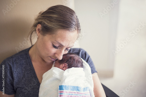 Fotografie Mother holding her newborn premature baby in the hospital