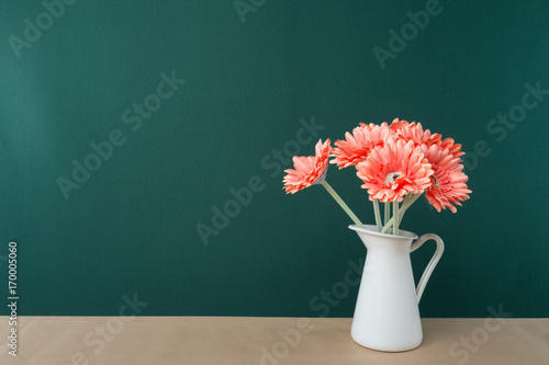 Gerbera daisy flowers on wooden white table