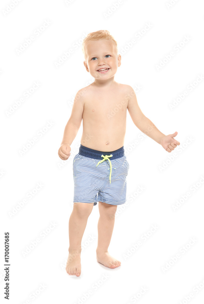 Adorable little boy in blue striped swim trunks isolated on white Adorable little boy in blue striped swim trunks isolated on white