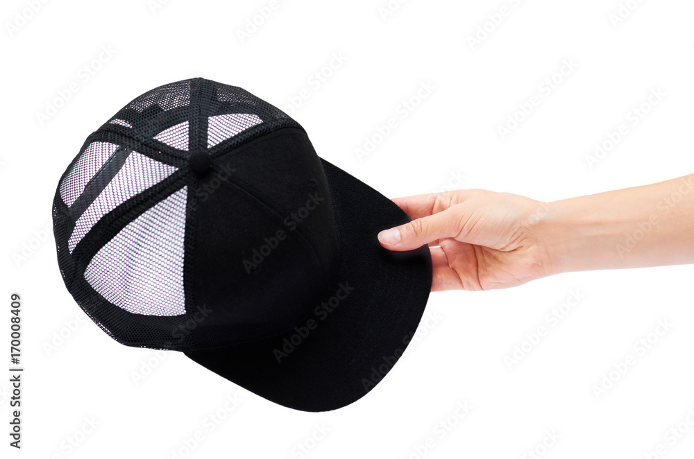 black cap in hand isolated on white background black cap in hand isolated on white background