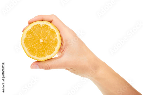 female hand holding lemon. Isolated on white background