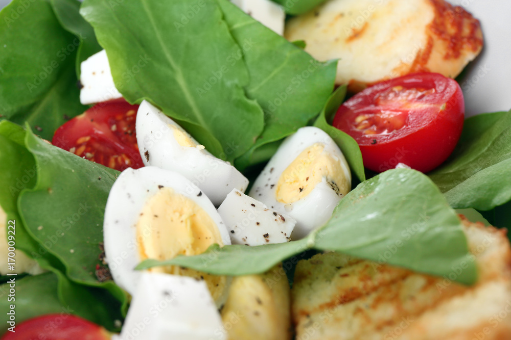 Salad with quail eggs and spinach, close up Salad with quail eggs and spinach, close up
