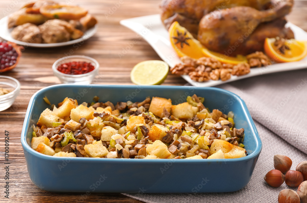 Turkey stuffing in blue casserole dish on kitchen table Turkey stuffing in blue casserole dish on kitchen table