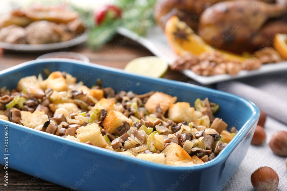 Turkey stuffing in blue casserole dish on kitchen table Turkey stuffing in blue casserole dish on kitchen table