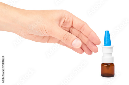 female hand holding nose spray bottle. Isolated on white background