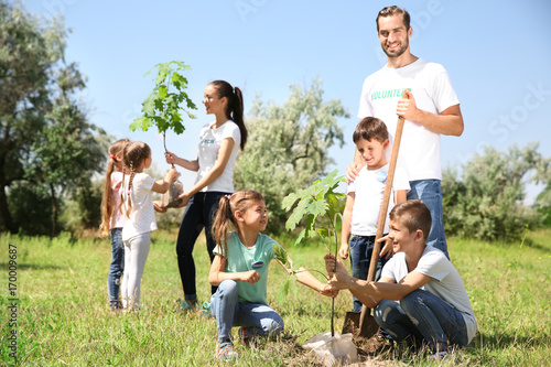 Young volunteers with child...