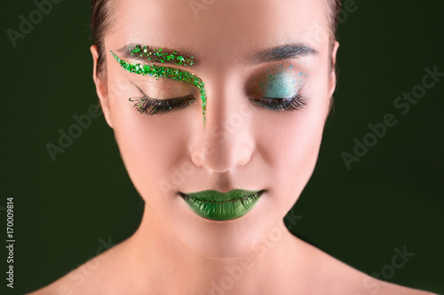 Beautiful girl with green make-up