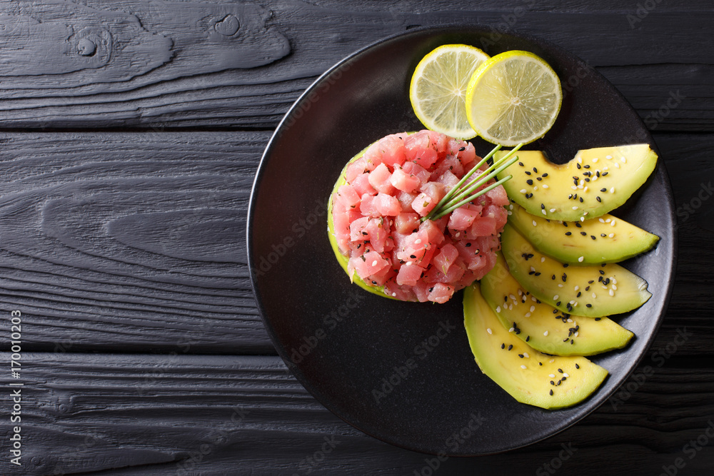Εκτύπωση καμβά Beautiful food: fresh tuna tartar with lime, avocado and sesame close-up