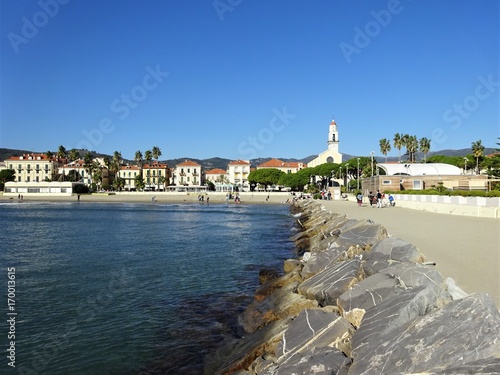 Diano Marina liguria italy, view from seaside on church and empty beach photo