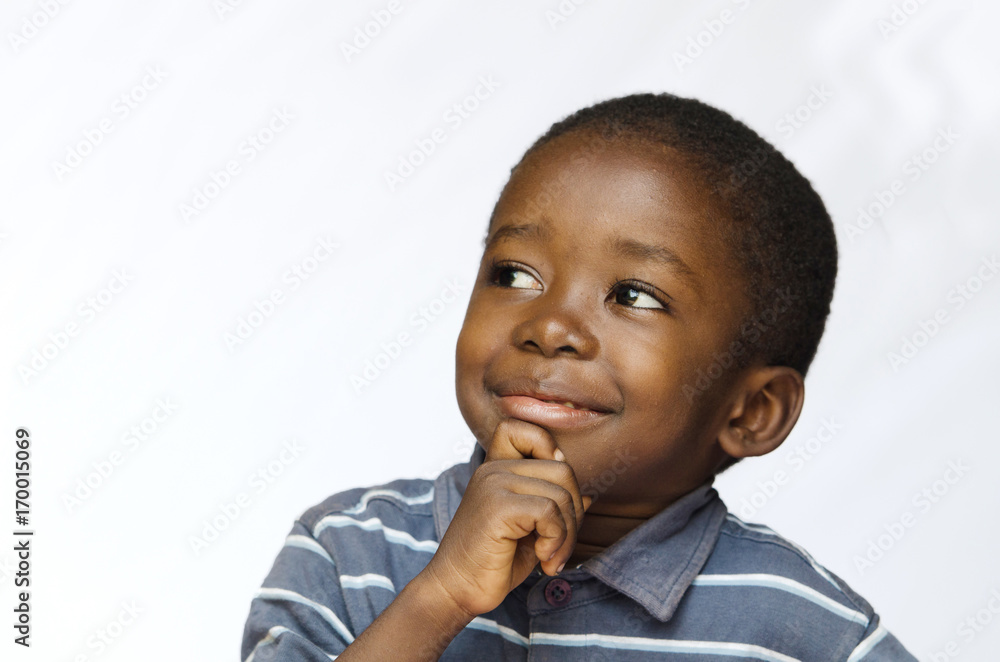 Little black boy thinking with hand on his chin Stock Photo Adobe Stock