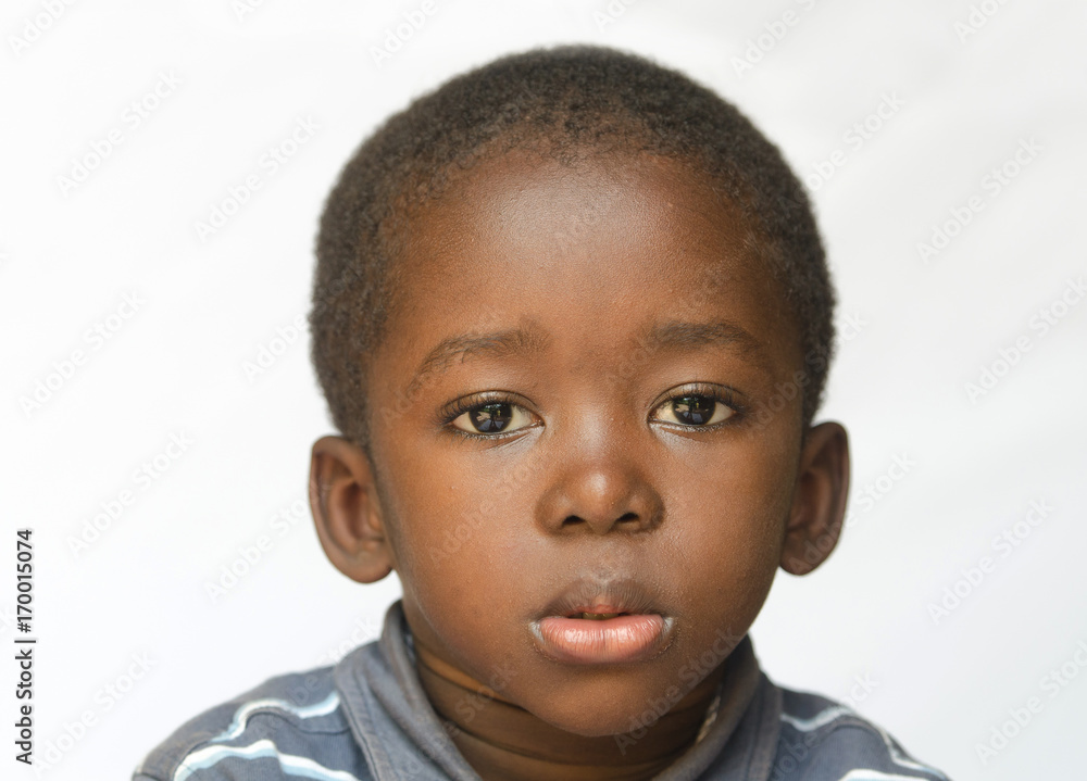 Φωτογραφία Close-up of African boy being a little sad, angry and full of despair