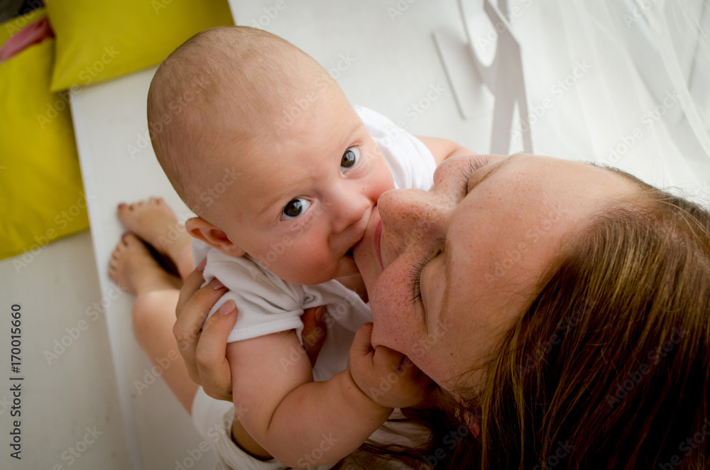 Happy mother with newborn baby
