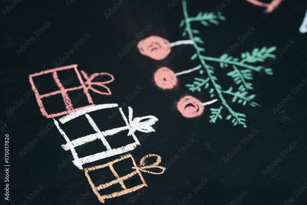 Christmas gift boxes chalk drawing on blackboard selective focus macro Christmas gift boxes chalk drawing on blackboard selective focus macro
