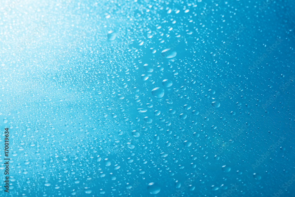 drops of water close-up on a blue background drops of water close-up on a blue background