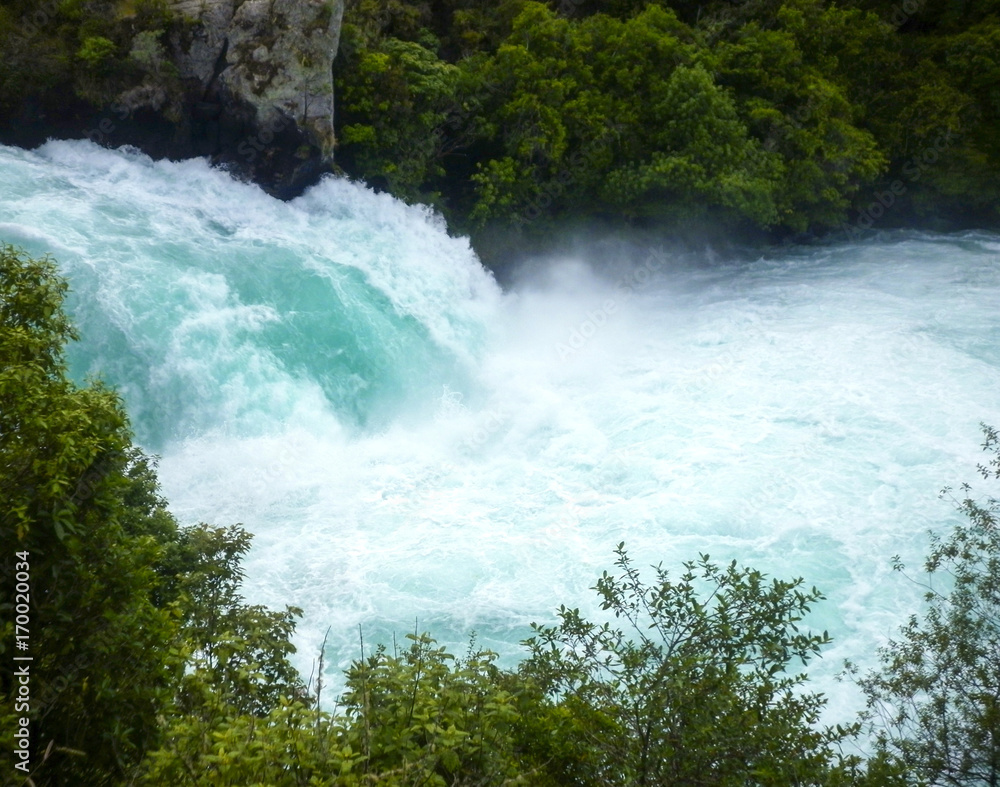 The rushing wild stream of Huka Falls near Lake Taupo, New Zealand The rushing wild stream of Huka Falls near Lake Taupo, New Zealand