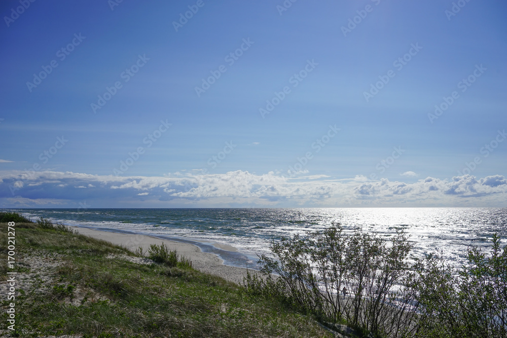 Deserted seascape on the Baltic sea and sand dunes