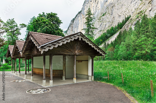  bus stop in the background of the mountains © lom742