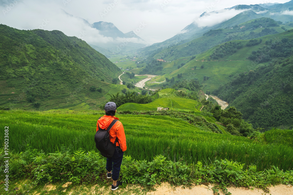 Young traveler standing and looking at view of nature at Sapa, vietnam