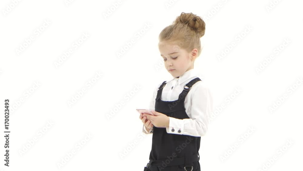 Sad baby communicates online in chat on smartphone, white background Sad baby communicates online in chat on smartphone, white background