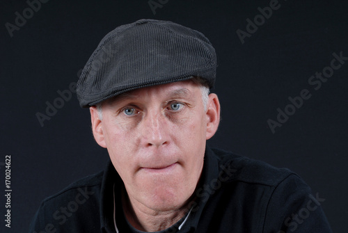 Portrait of mature man with cap