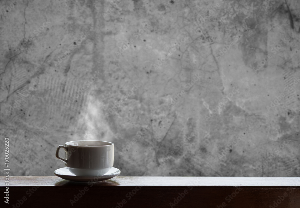 Cup of hot drinks with steam on wood table and concrete background, hot coffee, tea, chocolate and etc. Cup of hot drinks with steam on wood table and concrete background, hot coffee, tea, chocolate and etc.