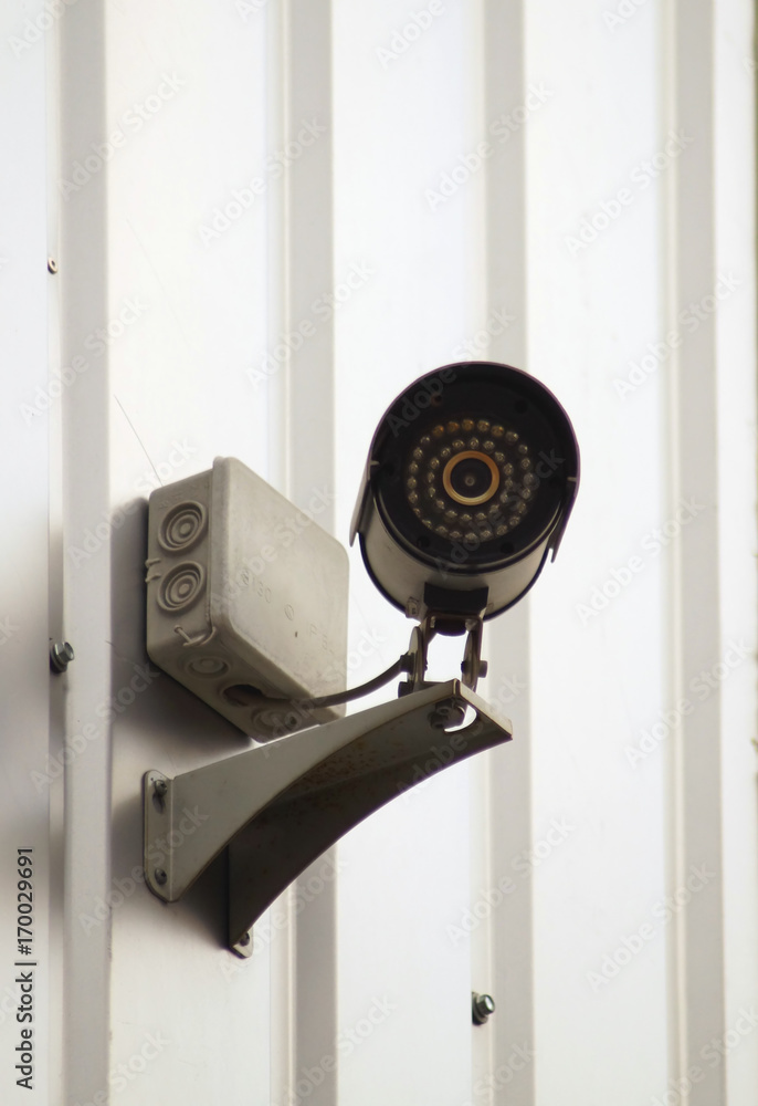 Camera surveillance on the wall of building.