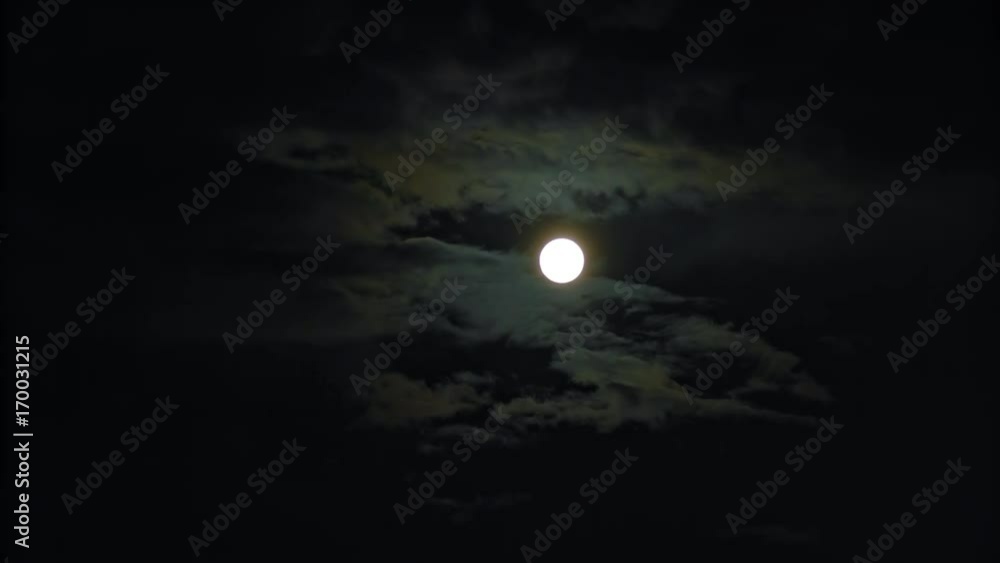 New moon and clouds in the pitchblack sky. Long shot New moon and clouds in the pitchblack sky. Long shot
