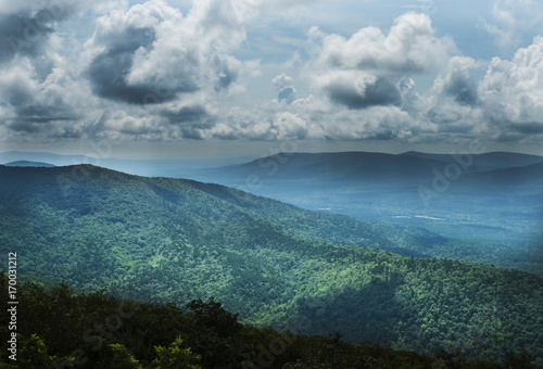 Scenic overlook from above, Oklahoma, southeastern region in the Ouachita Mountains, Talimena Scenic Byway. Blue mountains and dramatic clouds.