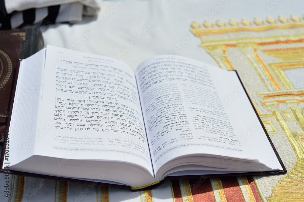 JERUSALEM, ISRAEL - APRIL 2017: Talmud Tora Tanach Books lying on table during prayer in Bar Mitzwa Ceremony at the Western Wall Jerusalem (Kotel) JERUSALEM, ISRAEL - APRIL 2017: Talmud Tora Tanach Books lying on table during prayer in Bar Mitzwa Ceremony at the Western Wall Jerusalem (Kotel)