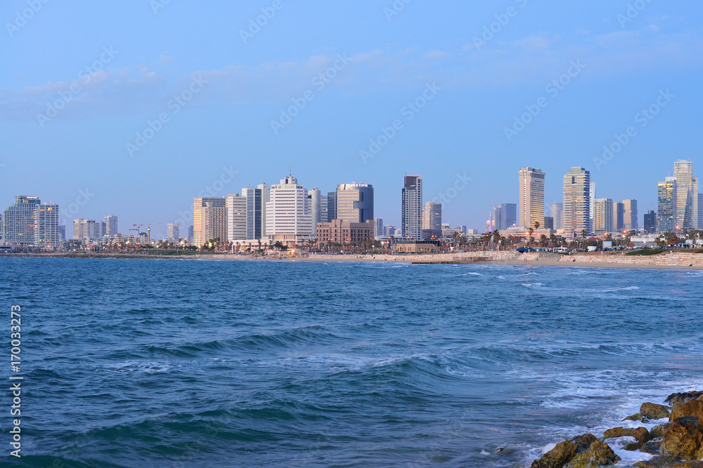 Fototapeta premium TEL AVIV, ISRAEL - APRIL, 2017: Evening view of the skyscrapers of Tel Aviv from the Mediterranean Sea.