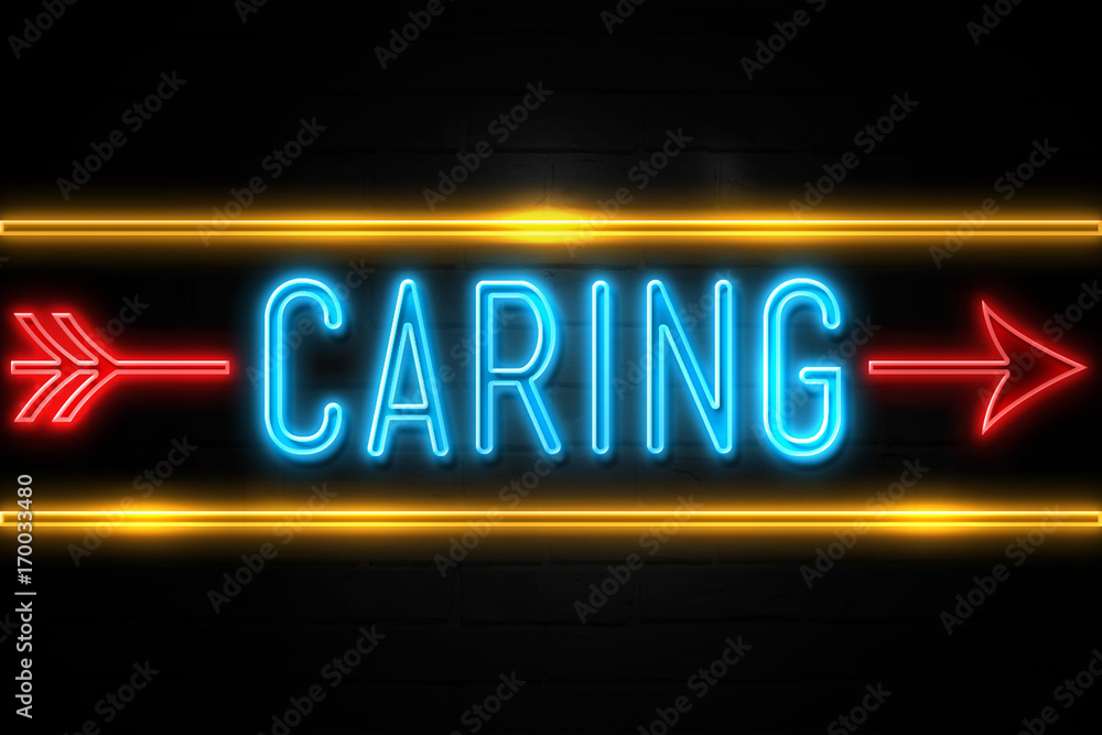 Caring  - fluorescent Neon Sign on brickwall Front view