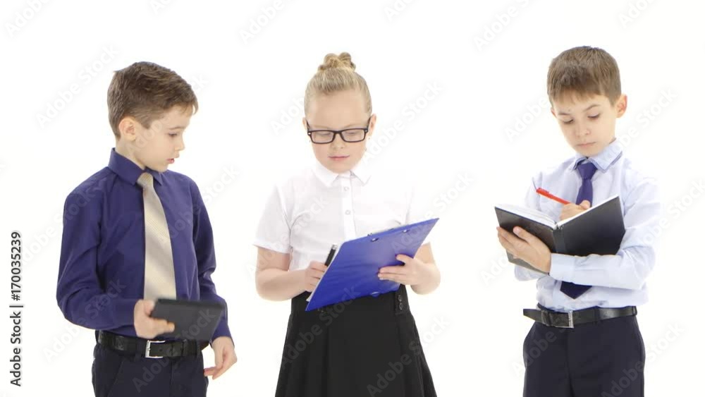 Important little business lady checks reports of her subordinates boys Important little business lady checks reports of her subordinates boys