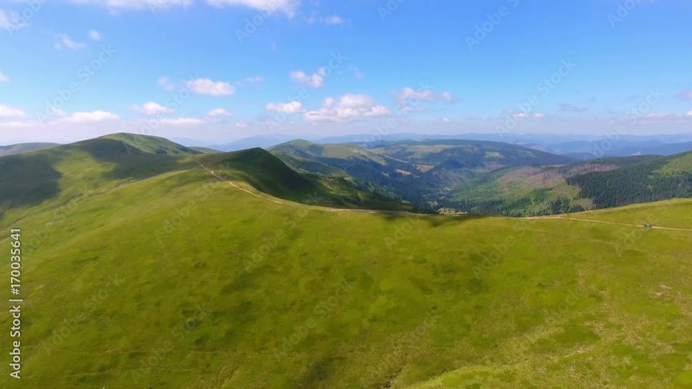 overlooking with covered of grass mountains. aerial view overlooking with covered of grass mountains. aerial view