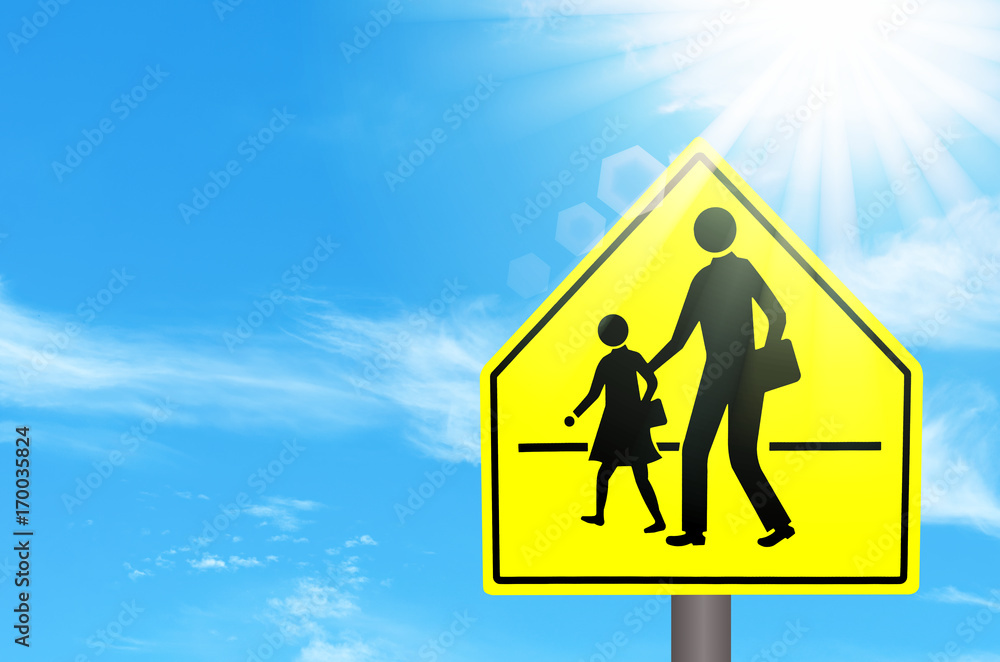 School zone warning sign on blue sky and sun light white clouds background. School zone warning sign on blue sky and sun light white clouds background.