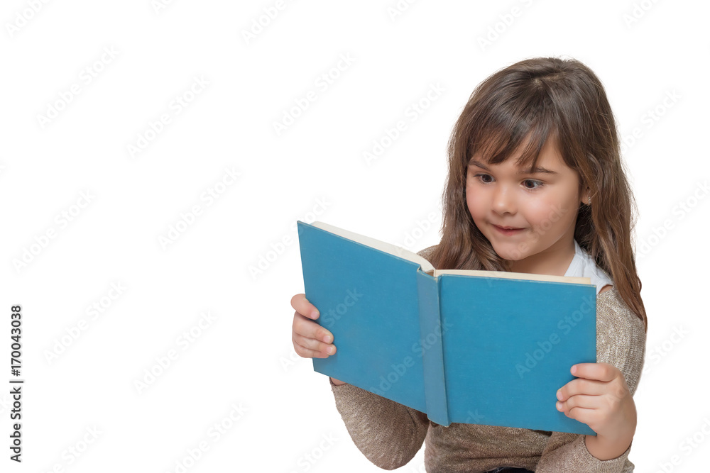 Front view of surprised little girl reading a book Front view of surprised little girl reading a book