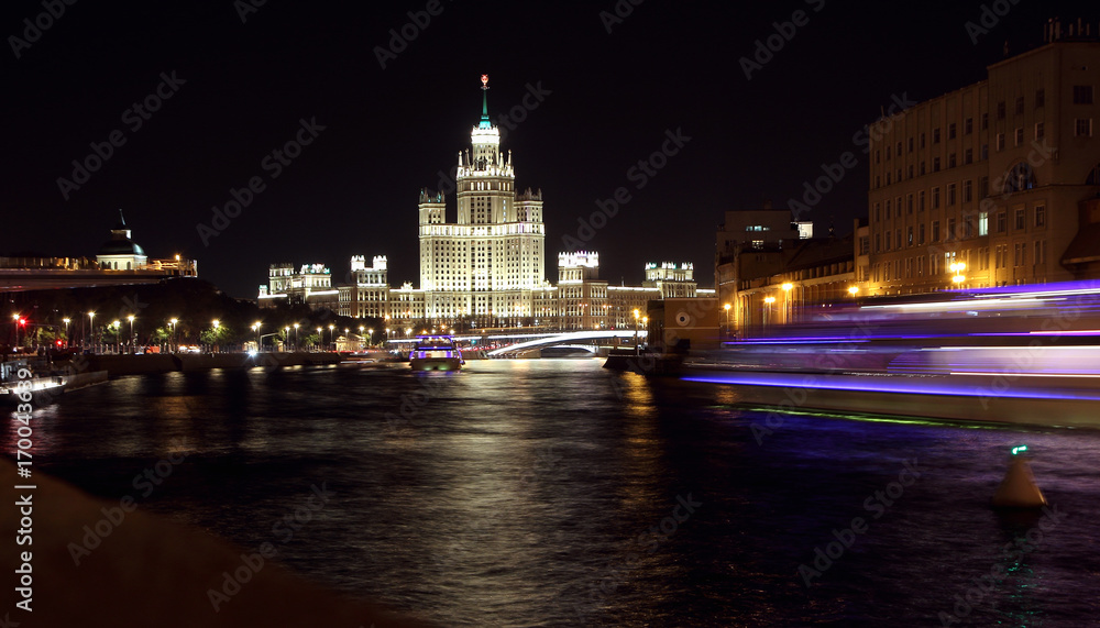  View of Vysotka on Kotelnicheskaya Embankment and Moscow River in the evening..