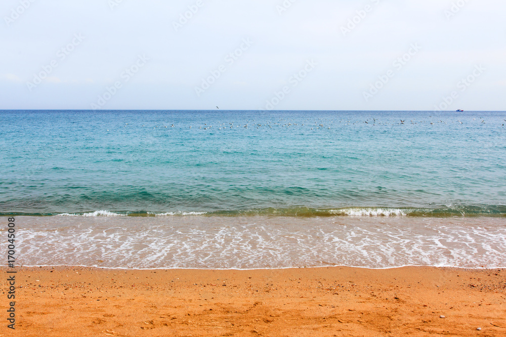 Soft wave of blue ocean on sandy beach. Tropical beach in Moroccan sea. belyouneche