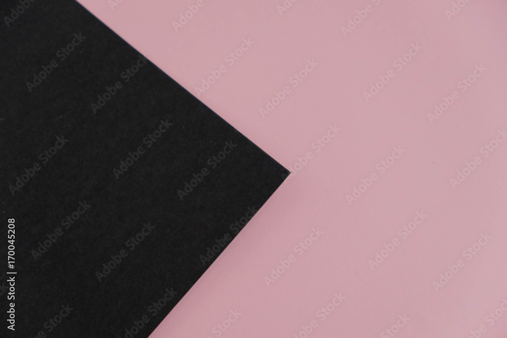pink torn paper element over black background.