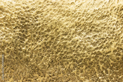 sheet of yellow metal,  tex...
