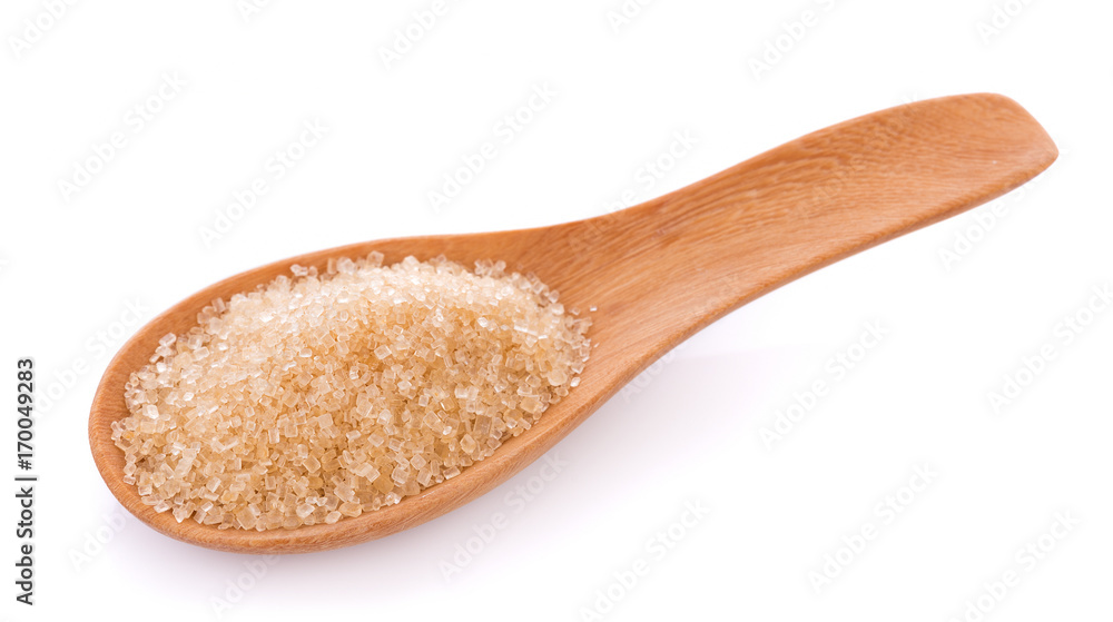 Brown sugar in wooden spoon on white background Brown sugar in wooden spoon on white background