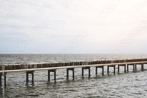 long bridge beside water pier