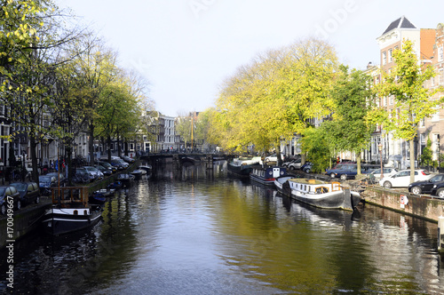 Old city houses along canal in Amsterdam, Holland