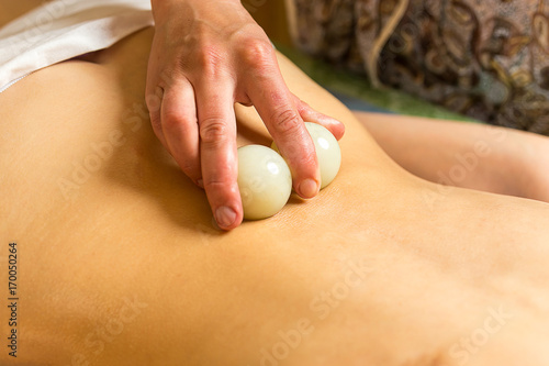 woman in wellness spa having aroma therapy massage with essential oil,Woman enjoying a Ayurveda oil massage treatment in a spa,Massage Techniques,back massage,Girl ayurvedic herbs massaging spa salon