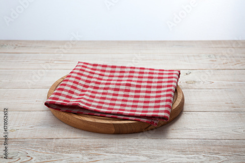 Napkin. Stack of colorful dish towels on white wooden table background top view
